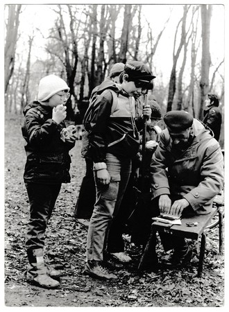 THE CZECHOSLOVAK SOCIALIST REPUBLIC - CIRCA 1980s: Retro photo shows young tourists and their chief in the forest. Black & white vintage photographyのeditorial素材
