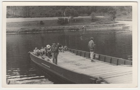 THE CZECHOSLOVAK SOCIALIST REPUBLIC - JULY 10, 1957: Retro photo shows tourists have a rest on the pontoon. Black & white vintage photographyのeditorial素材