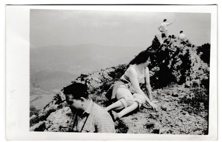 THE CZECHOSLOVAK SOCIALIST REPUBLIC - CIRCA 1950s: Retro photo shows tourists at the top of the hill. Summer vacation theme.  Vintage black & white photography.のeditorial素材