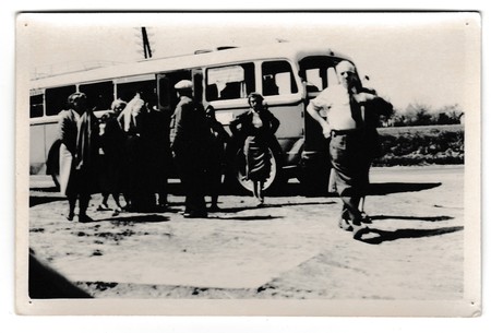 THE CZECHOSLOVAK SOCIALIST REPUBLIC - CIRCA 1950s: Retro photo shows tourists in front of the bus....