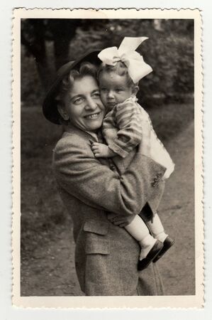 HODONIN, THE CZECHOSLOVAK REPUBLIC, CIRCA 1941: Vintage photo of a small girl with her aunt, circa...