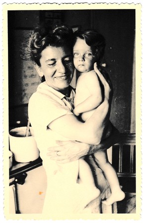 HODONIN, THE CZECHOSLOVAK REPUBLIC, CIRCA 1941: Vintage photo of mother and baby.  Photo with dark tint, circa 1941.のeditorial素材