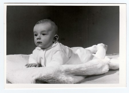 BRNO, THE CZECHOSLOVAK SOCIALIST REPUBLIC, MARCH 10, 1972: Retro photo of  baby boy (six months old).  Portrait photo was taken in photo studio on March 10, 1972.のeditorial素材