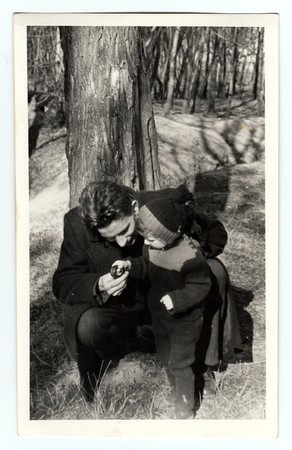 HODONIN, THE CZECHOSLOVAK REPUBLIC, CIRCA 1941: Vintage photo shows a small girl with her uncle in...