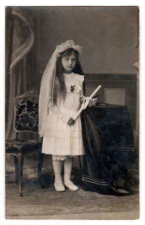 HODONIN, THE CZECHOSLOVAK REPUBLIC, CIRCA 1930: Vintage photo of a young girl - her first holy communion, circa 1930.のeditorial素材