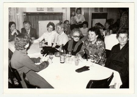 THE CZECHOSLOVAK SOCIALIST REPUBLIC, 1985: Vintage photo shows a group of people in the restaurant.のeditorial素材