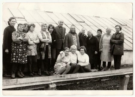 THE CZECHOSLOVAK SOCIALIST REPUBLIC, CIRCA 1980: Vintage photo shows farmers in front of greenhouse.のeditorial素材