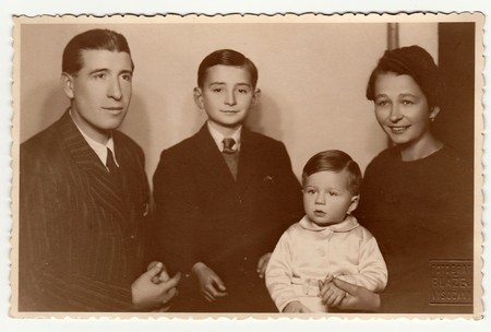 PRAGUE, THE CZECHOSLOVAK SOCIALIST REPUBLIC - CIRCA 1950s: Vintage photo shows family portrait.のeditorial素材