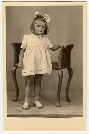 THE CZECHOSLOVAK REPUBLIC - CIRCA 1940s: Vintage photo shows a small girl with ribbon on hair.のeditorial素材