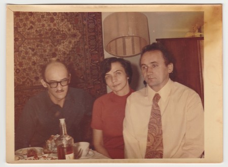 USSR - CIRCA 1970s: Vintage photo shows family during feast.のeditorial素材