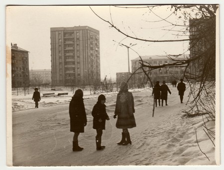 USSR - CIRCA 1980s: Vintage photo shows  girls and boy talk on street in winter.