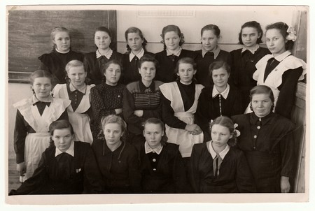 USSR - CIRCA 1950S: Vintage photo shows schoolmates (girls) and their female teacher.のeditorial素材