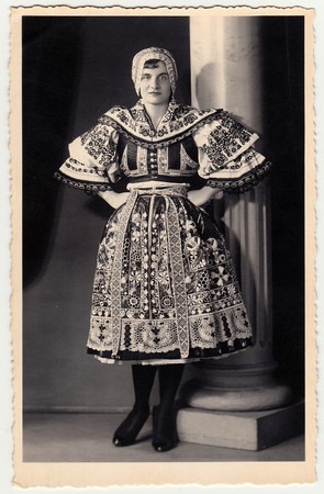 HODONIN, THE CZECHOSLOVAK REPUBLIC - CIRCA 1920s: Vintage photo shows woman in a folk costum.のeditorial素材