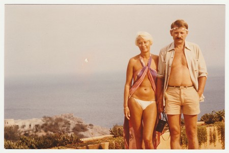 IBIZA, SPAIN - 1981: Vintage photo shows couple on summer vacation at sea resort.のeditorial素材