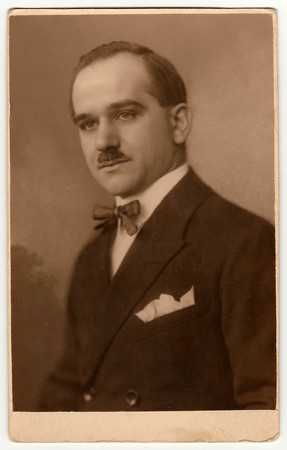 PRAGUE, THE CZECHOSLOVAK REPUBLIC - 1925: Vintage studio portrait shows man wears jacket and bow...