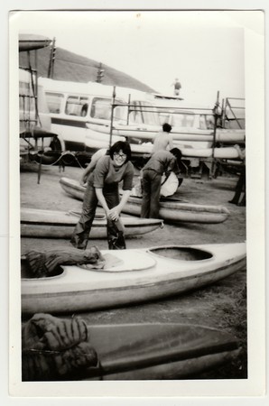 THE CZECHOSLOVAK SOCIALIST REPUBLIC - CIRCA 1980s: Vintage photo shows young canoeist prepares to canoeing.のeditorial素材