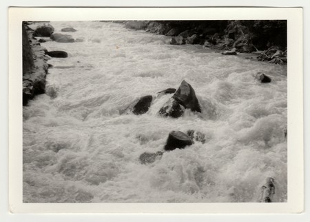 THE CZECHOSLOVAK SOCIALIST REPUBLIC - CIRCA 1980s: Vintage photo shows wild river.のeditorial素材