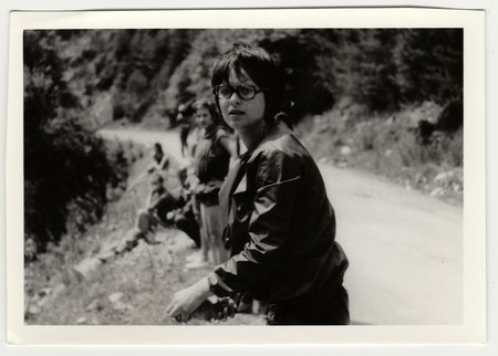 THE CZECHOSLOVAK SOCIALIST REPUBLIC - CIRCA 1980s: Vintage photo shows young boy with glasses outdoors.のeditorial素材