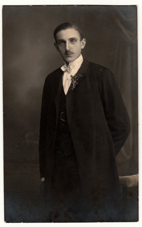 THE CZECHOSLOVAK REPUBLIC - CIRCA 1920s: Vintage photo shows young groom wears dinner-jacket (tuxedo). Antique black & white photo.のeditorial素材