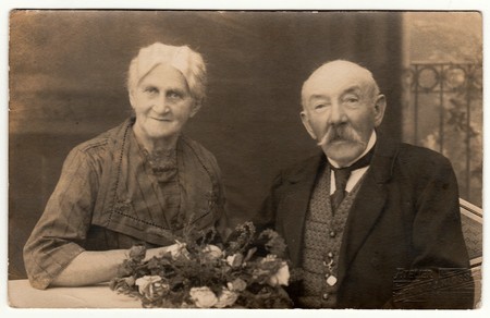 LIBEREC (REICHENBERG), THE CZECHOSLOVAK REPUBLIC - CIRCA 1920s: Vintage photo shows an older couple. Antique black & white photo.のeditorial素材