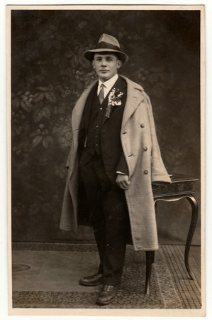 THE CZECHOSLOVAK REPUBLIC - CIRCA 1920s: Vintage photo shows young groom wears his posh (Sunday best) clothes.  Antique black & white studio portrait.のeditorial素材