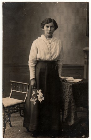 THE CZECHOSLOVAK REPUBLIC - CIRCA 1920s: Vintage photo shows woman holds the flowers.  Black & white...