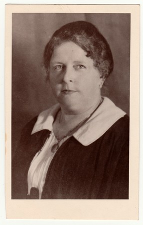LIBEREC (REICHENBERG), THE CZECHOSLOVAK REPUBLIC - CIRCA 1930s: Vintage photo shows a mature woman...