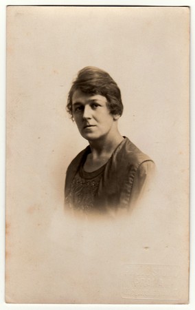 PRAGUE, THE CZECHOSLOVAK REPUBLIC - CIRCA 1930s: Vintage photo shows face of woman (portrait). Antique black & white photography.のeditorial素材