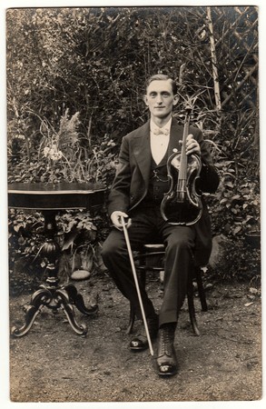 TTHE CZECHOSLOVAK REPUBLIC. - CIRCA 1930s:  Vintage photo shows young man poses with the violin...