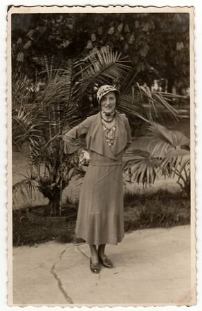 TRENCIANSKE TEPLICE, THE CZECHOSLOVAK REPUBLIC - CIRCA 1930s: Vintage photo shows an elegant woman...