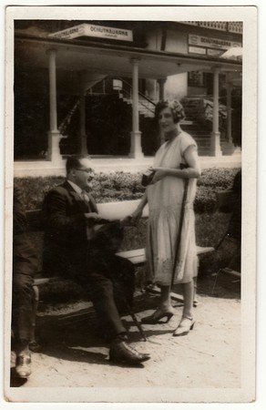 KARLOVY VARY, THE CZECHOSLOVAK REPUBLIC - CIRCA 1930s: Vintage photo shows the elegant man and woman...