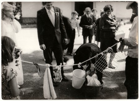 THE CZECHOSLOVAK SOCIALIST REPUBLIC - CIRCA 1970s: Retro photo shows wedding guests during rural wedding celebration. Black & white vintage photography.のeditorial素材