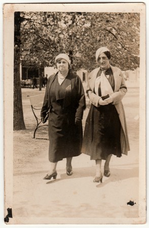THE CZECHOSLOVAK REPUBLIC - CIRCA 1930s: Vintage photo shows women go for a walk in the city park. Original retro black & white photography.のeditorial素材