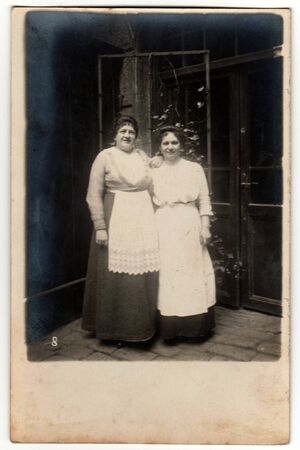 THE CZECHOSLOVAK REPUBLIC - CIRCA 1930s: Vintage photo shows two housekeepers pose outside - in the...