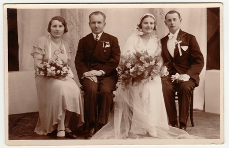 THE CZECHOSLOVAK  REPUBLIC -  APRIL 29, 1933: Vintage photo shows newlyweds and parents. Retro black & white studio photography.のeditorial素材