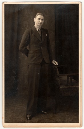 THE CZECHOSLOVAK REPUBLIC -  CIRCA 1920s: Vintage photo shows young man poses in photography studio....
