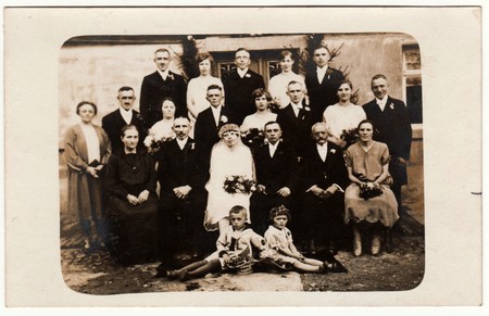THE CZECHOSLOVAK REPUBLIC - CIRCA 1920s: Vintage photo shows newlyweds, bridesmaids, bridesmen and other wedding guests. Retro black & white photography.のeditorial素材