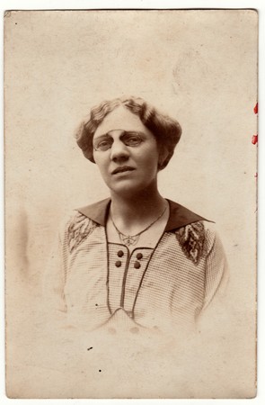 AUSTRIA-HUNGARY - CIRCA 1917: Vintage photo shows a mature woman wears vintage antique nose clip...