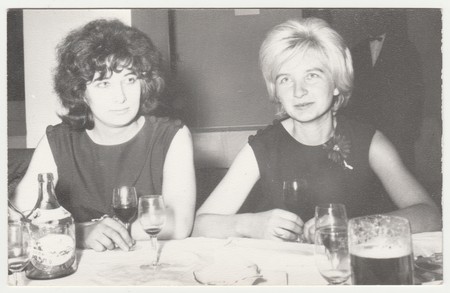 THE CZECHOSLOVAK SOCIALIST REPUBLIC - CIRCA 1970s: Vintage photo shows  women  during party. Women hold the glasses of wine. Retro black & white photography.のeditorial素材