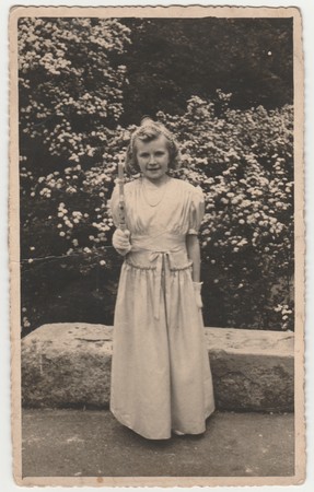 THE CZECHOSLOVAK  REPUBLIC - CIRCA 1940s: Vintage photo shows girl after her first communion. Retro black & white  photography.のeditorial素材