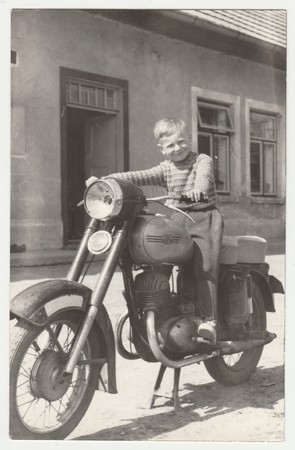THE CZECHOSLOVAK SOCIALIST REPUBLIC - CIRCA 1960s: Vintage photo shows boy sits on the vintage...
