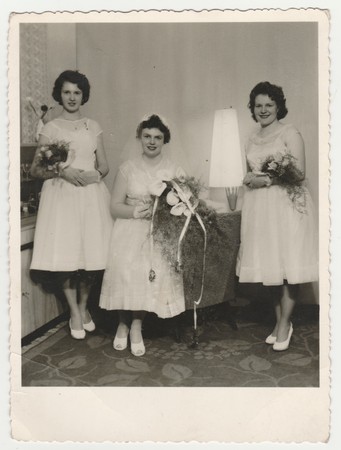 THE CZECHOSLOVAK SOCIALIST REPUBLIC - CIRCA 1960s: Vintage photo shows a bride with bridesmaids. Bride wears  a soft veil and holds calla flowers (bouquet) . Retro black & white  photography.のeditorial素材