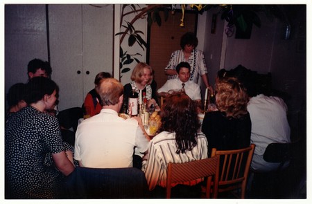 THE CZECHOSLOVAK REPUBLIC - CIRCA 1990s: Retro photo shows people at the home party. Vintage color photography.のeditorial素材