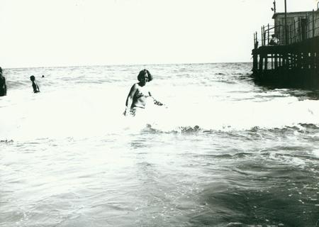 THE CZECHOSLOVAK SOCIALIST REPUBLIC - CIRCA 1970s: Retro photo shows woman on coastline (sea surf). Vintage photography.のeditorial素材