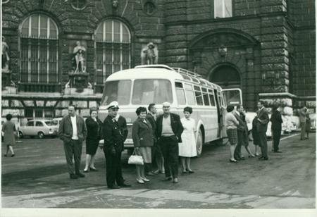 THE CZECHOSLOVAK  SOCIALIST REPUBLIC - CIRCA 1970s: Retro photo shows a group of tourists stand around the vintage bus. Vintage  photography.のeditorial素材