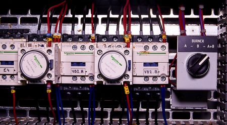 Image shows control cubicle. Schneider electric device and Schneider circuit breakers inside power case.のeditorial素材