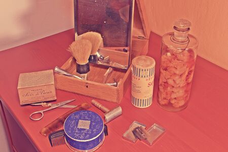 Vintage shaving accessories, perfumes and face powder. Close-up. Add retro effectのeditorial素材