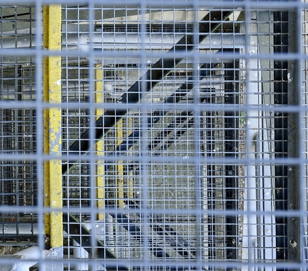 Industrial stairway. Close-up. Industrial iron staircase. Background. Macro image can be used as background.の写真素材