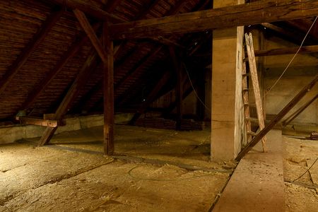 Attic loft insulation. Old loft. renovation and thermal insulation with mineral rock woolの写真素材