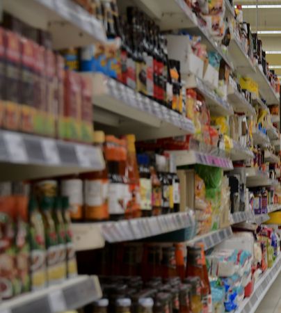 Blurred section at retail store in Europe.  Aisle in local supermarket, defocused background